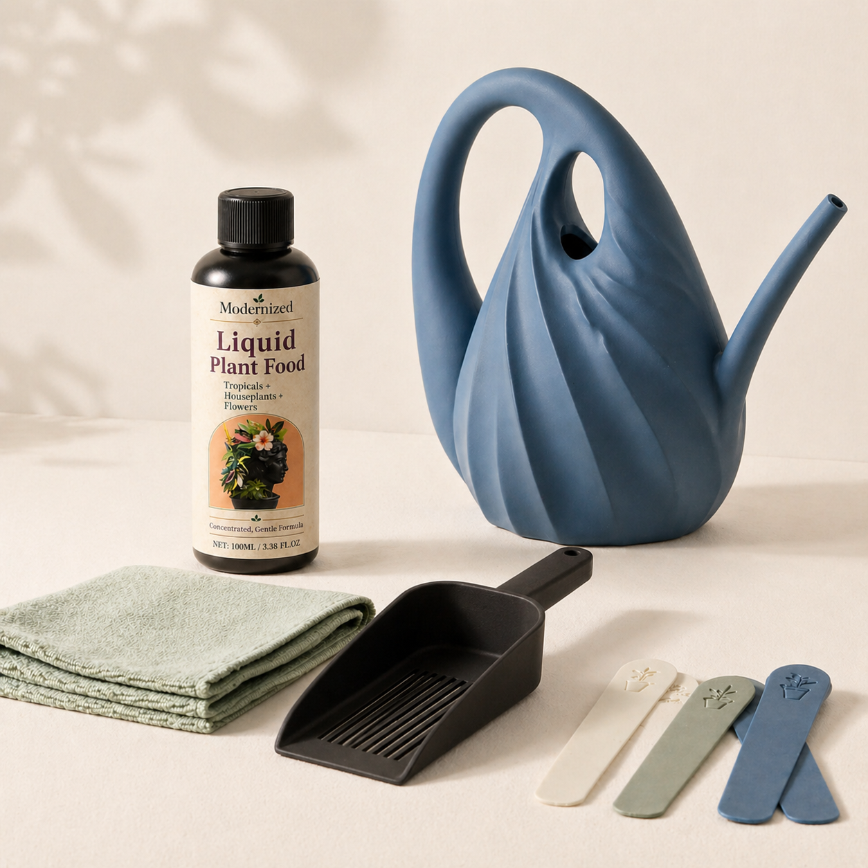 Month 9 plant care upgrade gift with watering can, soil scoop, cloth, plant tags, and plant food refill